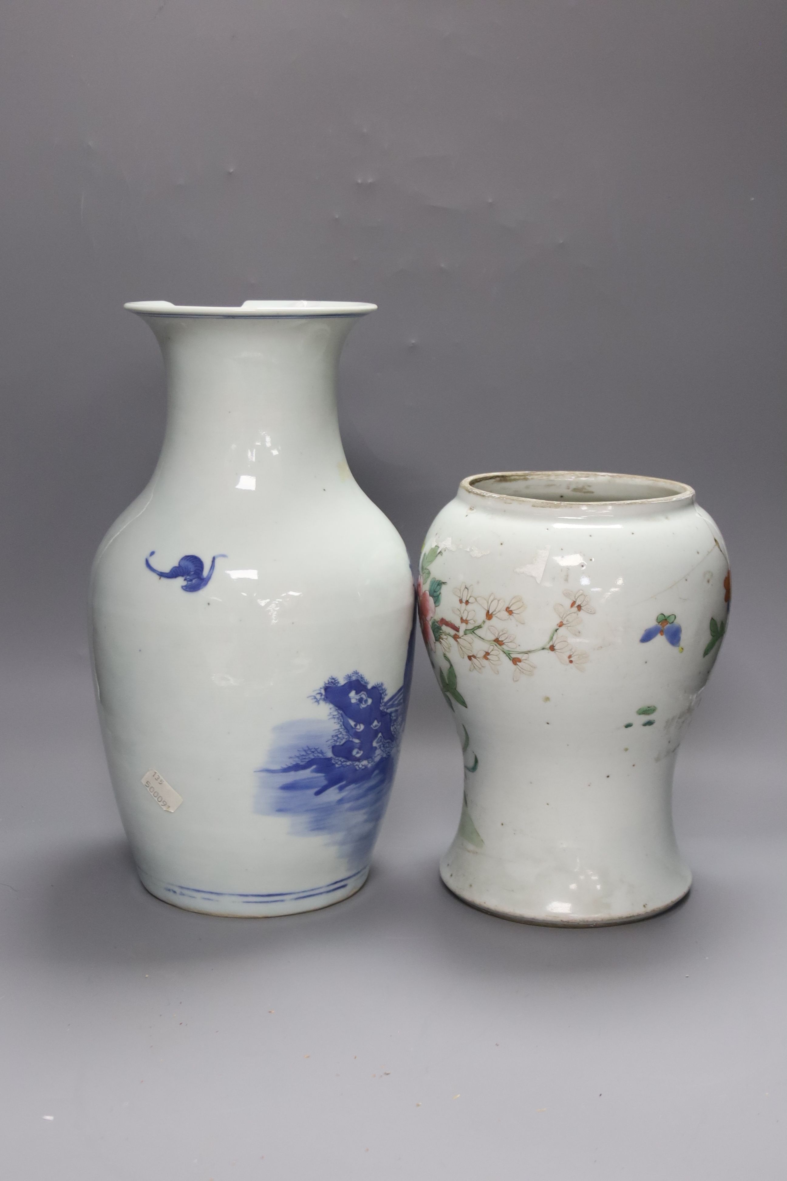 A Chinese blue and white 'Immortals' vase, 18th/19th century, damage, 34.5cm and a Chinese Yongzheng period famille rose ‘phoenix’ vase (reduced in height), 24cm